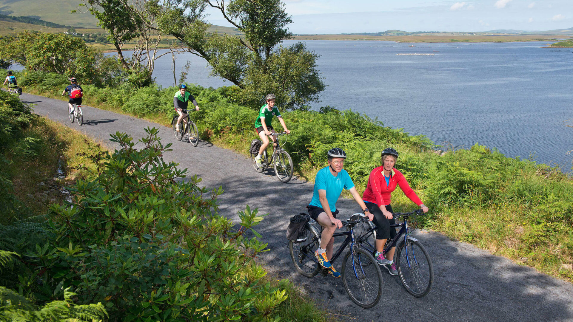 Cyclists cycling along the scenic off-road Great Western Greenway trail